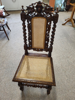 Four beautifully carved antique oak Carolean rattan chairs